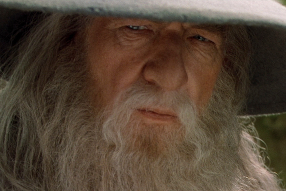 Image of Gandalf peering offscreen for magician archetype