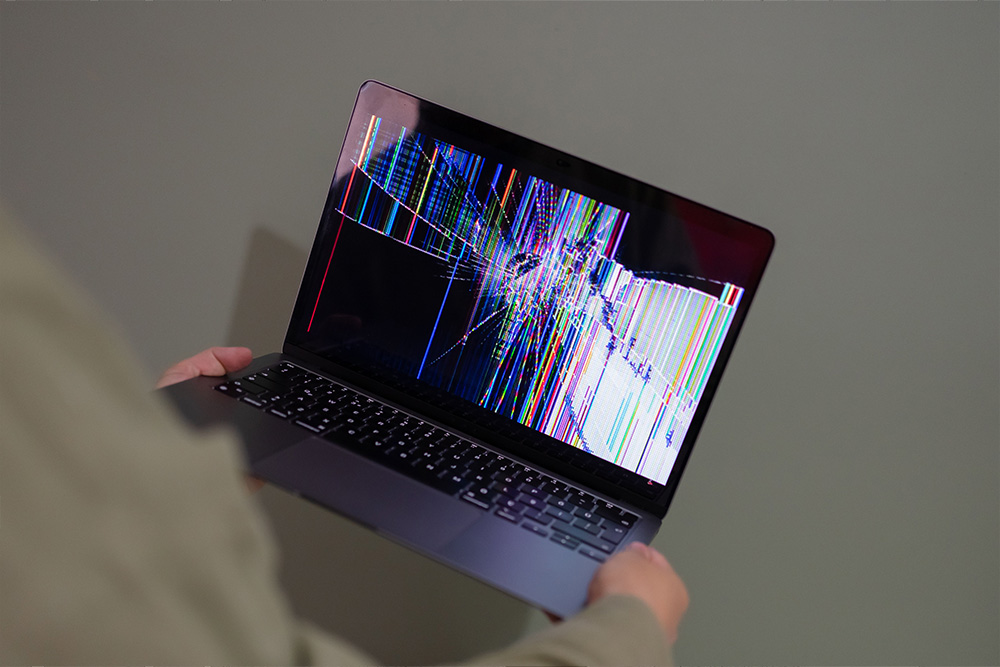A broken laptop, presumably because of frustration with formal diction