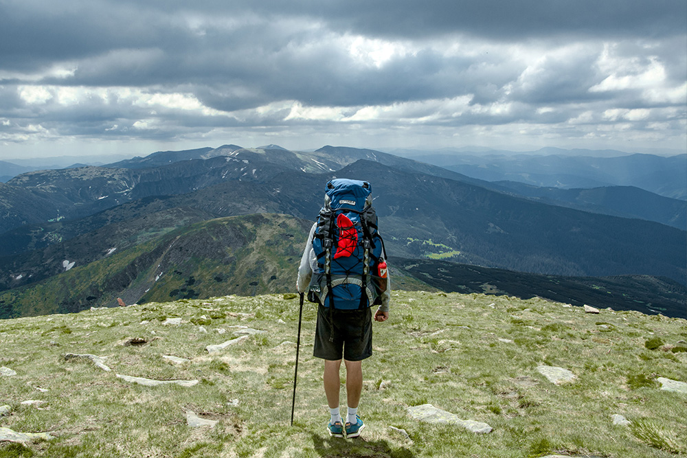 A person standing at the peak of a mountain: tackling difficult and expansive themes in dramatic questions