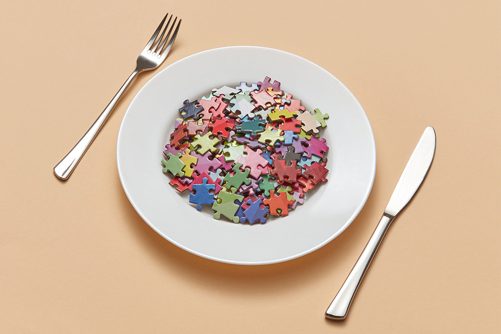 A bowl filled with puzzle pieces to suggest a lack of clarity for the recipient of this meal