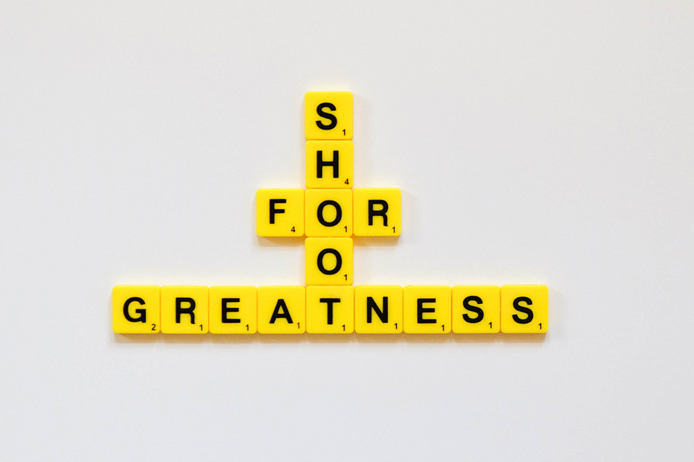A frame that says "shoot for greatness" but can be read different ways based on the visual syntax that users are used to reading it with