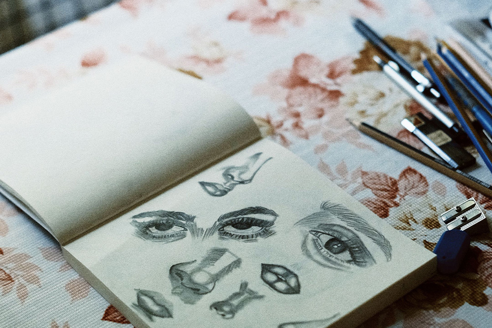 A drawing of different facets of a character's face as a stand in for character sketch in writing