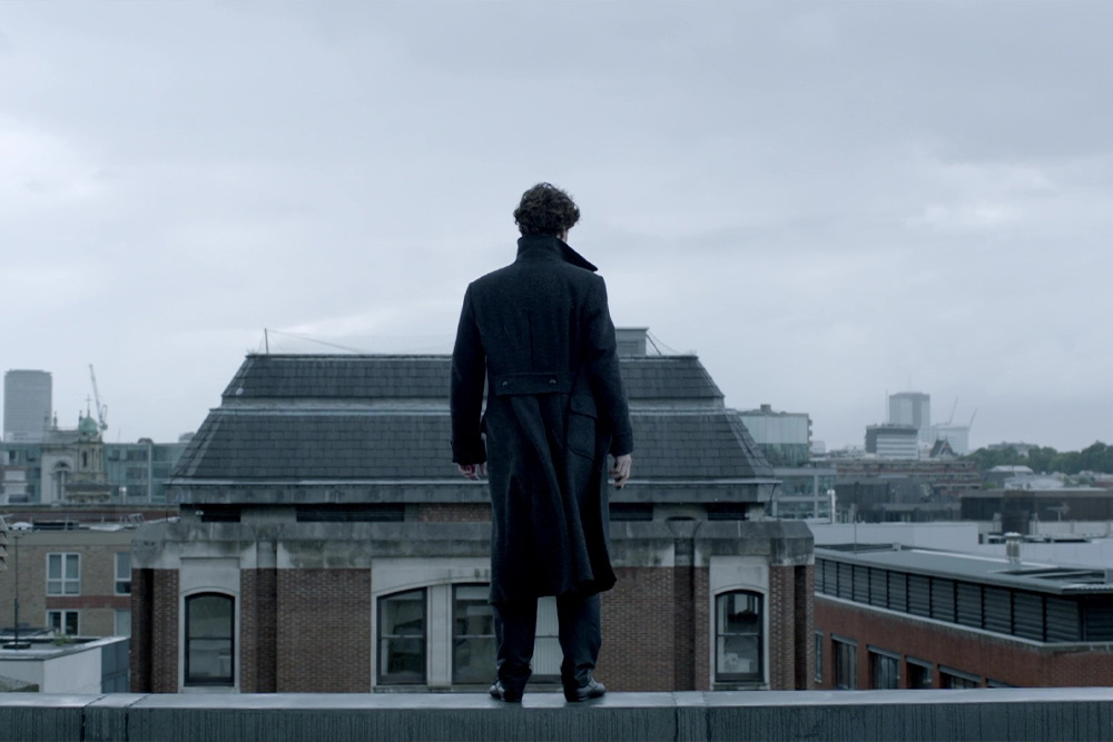 An image of Sherlock Holmes standing on a rooftop to suggest his personality strengths and weaknesses in compelling writing