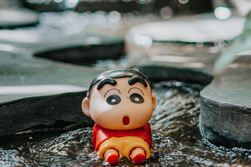 Shinchan in a river to suggest inner contemplation with the character bio template