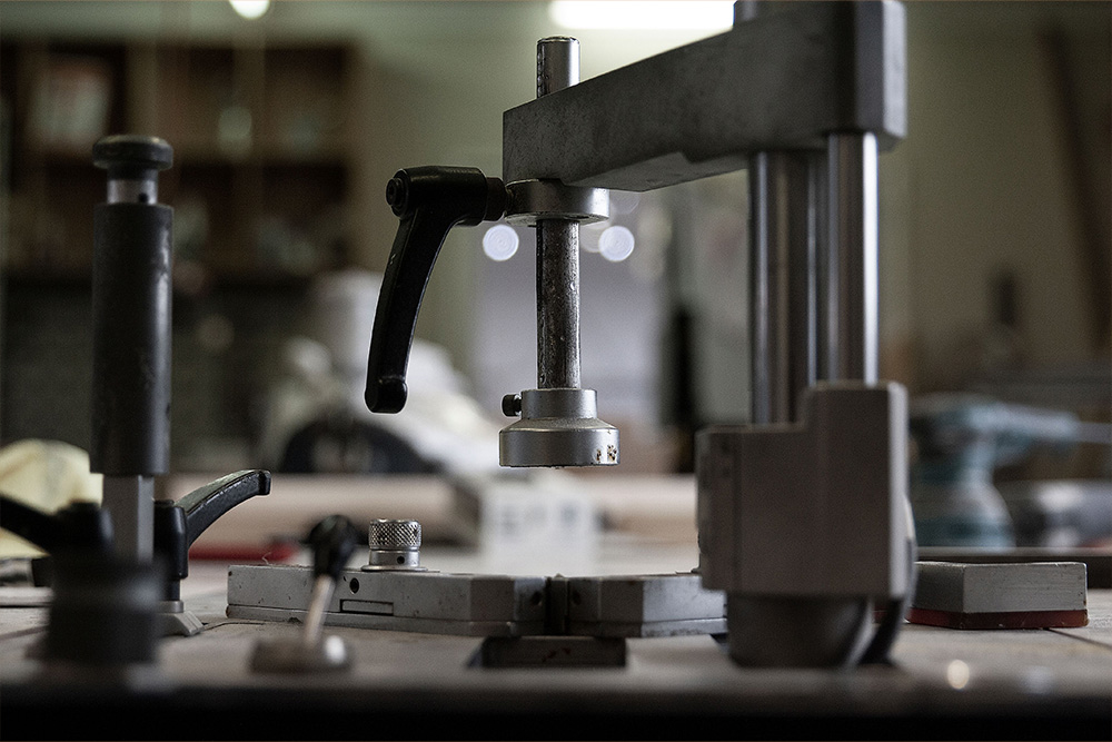 A hydraulic press to suggest that a character bio template will hone in your story 