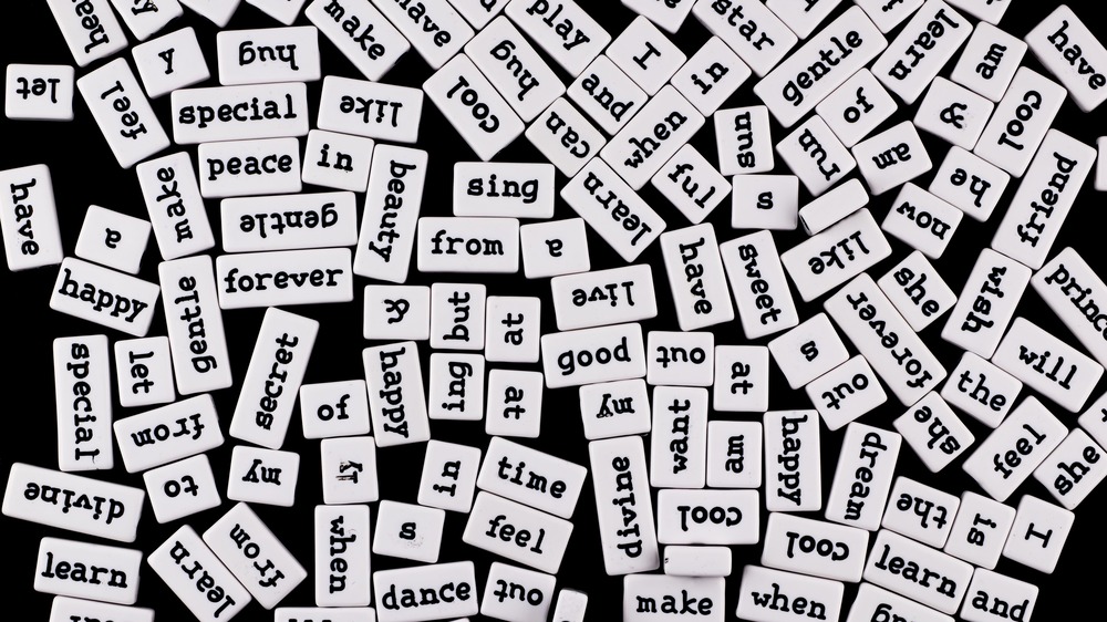 A collection of word magnets representing the idea that all language is invented, including made-up words.