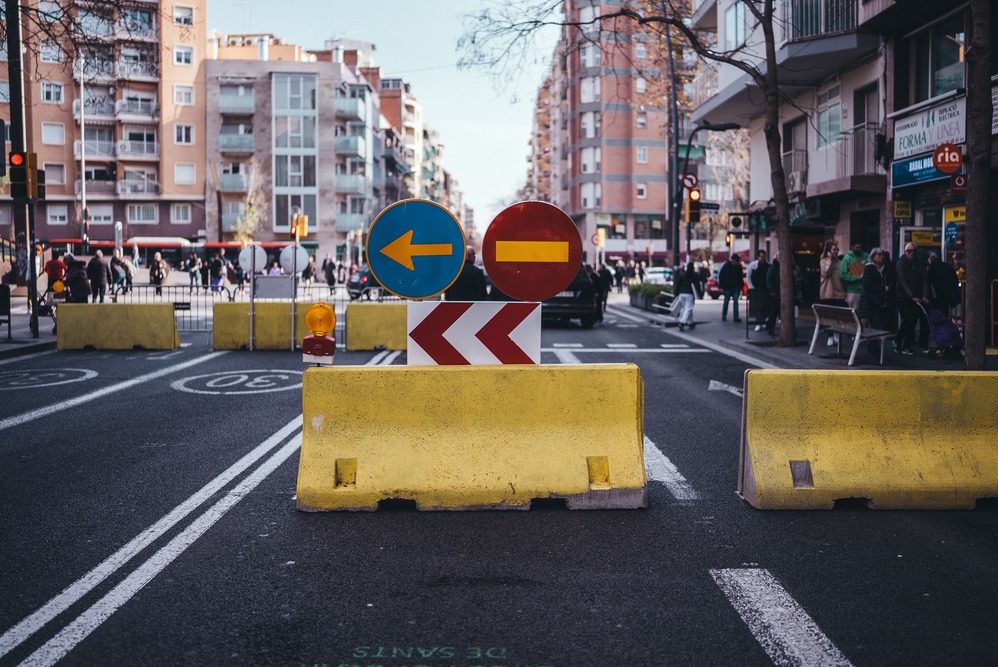 A physical roadblock symbolizing a metaphorical roadblock that might create tension in writing.