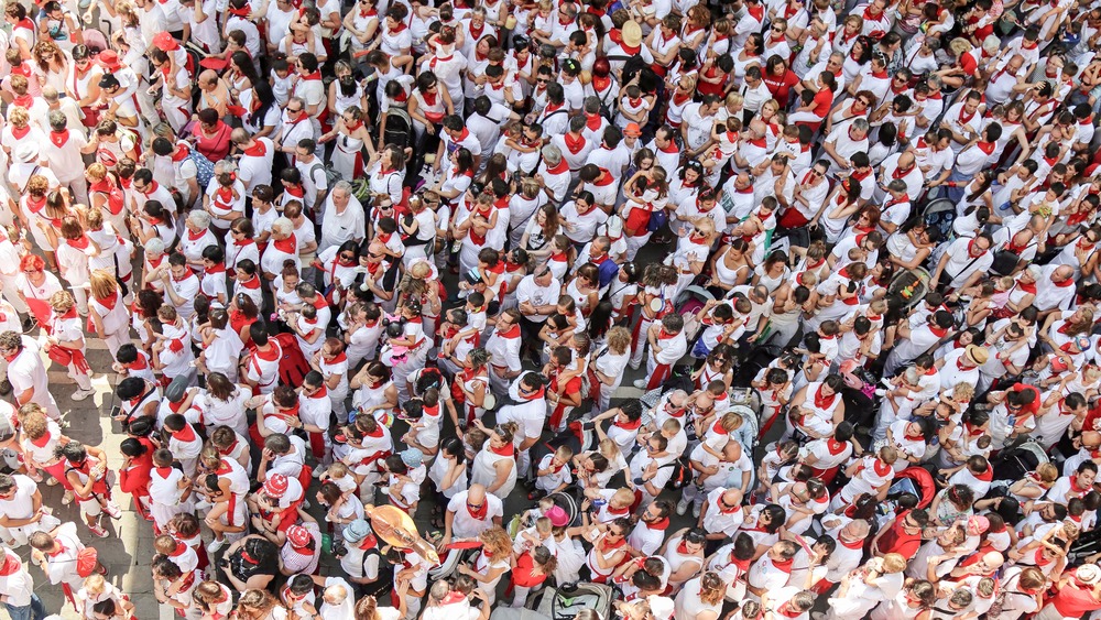 A sea of people, all of whom might share a voice in the fourth person point of view.